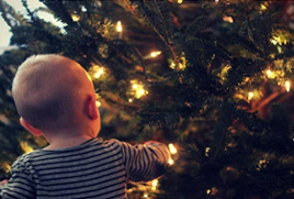 Baby and Christmas tree