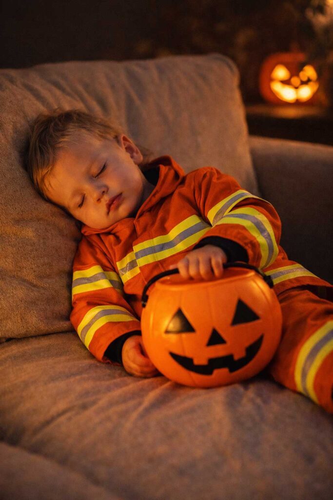 Toddler resting after Halloween showing signs of overstimulation